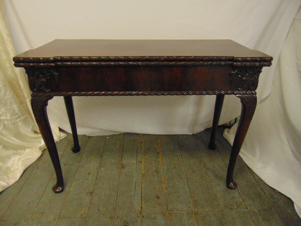 A mahogany rectangular Hepplewhite style games table on cabriole legs