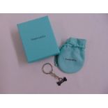 A Tiffany and Co. keyring in the form of a dogs bone with original pouch and packaging