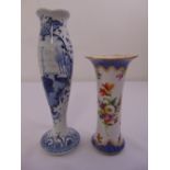 Delft blue and white stem vase and a Dresden vase decorated with flowers