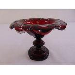 A Victorian ruby cut glass fruit stand on knopped stem and raised circular base