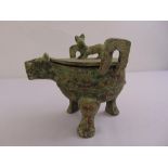 A Chinese bronze incense burner in the form of a stylised animal with pull off cover all on three