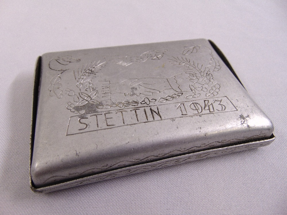 A WWII Prisoner of War work cigarette case engraved with date 1943