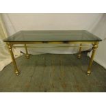 A gilded metal and glass rectangular coffee table