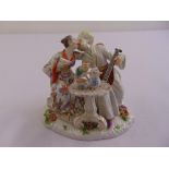 Meissen chinoiserie figural group of seated lovers with a musical instrument by a tea table, incised