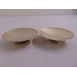 A pair of silver circular bonbon dishes on raised circular bases, Birmingham 1941