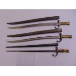 Three military bayonets with brass handles in original fitted scabbards