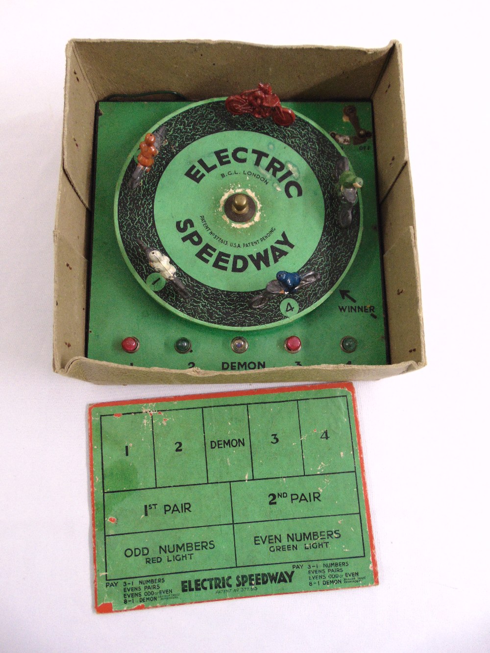 A 1930s Electric Speedway game with original painted motorbikes, score board and packaging