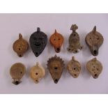 Ten Roman terracotta antique oil lamps of various forms and size