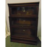 Globe Wernicke mahogany three section bookcase with raised plinth and top section, label to