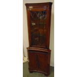 Mahogany rectangular bow front corner cabinet with hinged glazed door on bracket feet