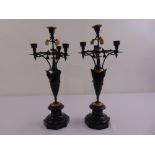 A pair of 19th century Art Nouveau style bronze candelabra on raised octagonal marble bases