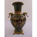 A Chinese export bronze and gilded metal vase with elephant head side handles on pierced rectangular