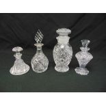 Four cut glass scent bottles with drop stoppers