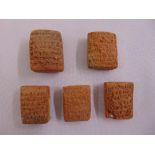 Five Middle Eastern rectangular tablets carved with characters