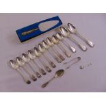 A quantity of silver and white metal flatware to include a cased cake slice and teaspoons