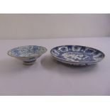 A Chinese blue and white dish on raised circular base and a Chinese blue and white plate, marks to