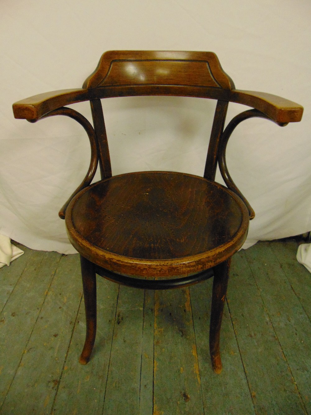 A bentwood office chair with outswept arms circa 1920