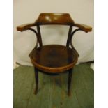 A bentwood office chair with outswept arms circa 1920