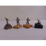 Four Israeli white metal figurines of religious characters on stone plinths