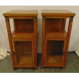 A pair of rectangular satinwood Biedermeier style cabinets with gilt mounts and hinged glazed doors