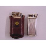 Two vintage Dunhill lighters with engine turned finish the other in original leather case (2)