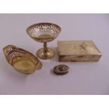 Two pierced silver bonbon dishes, an oval pill box and a cigarette box