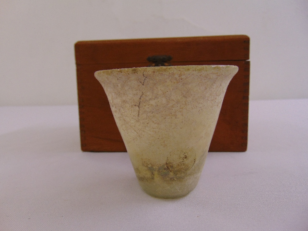 An early Roman glass beaker in cedarwood case