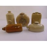 Five early 20th century ceramic hot water bottles of varying shape and form