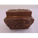 A Chinese shaped rectangular bronze covered box heavily chased with dragons and flowers