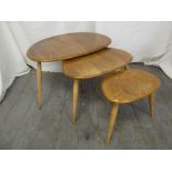 Ercol nest of three tables of oval form with spindle legs, label to base