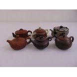 Five oriental terracotta teapots one with jade handle and spout and one metal teapot