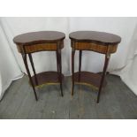 A pair of Kingswood kidney shaped side tables with gilded metal mounts, on four tapering cabriole