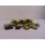 A quantity of Dinky military vehicles to include anti tank guns, gun carriages, centurion tank,