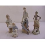 Four Lladro figurines of children