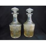 A pair of Georgian cut glass decanters with drop stoppers