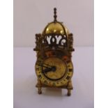 A 17th century style brass lantern clock of customary form with modern conversion