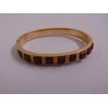 9ct yellow gold and cornelian bangle, approx total weight 14.0g