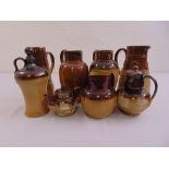 A quantity of Doulton Lambethware to include a teapot, jugs and flagons (8)