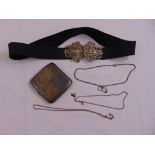 A quantity of silver to include a Nurses belt buckle, a cigarette case and neck chains