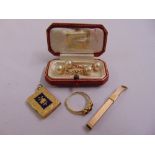 A quantity of 9ct yellow gold to include an engine turned toothpick, a locket, a ring and a pair