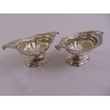 A pair of George III silver hallmarked pedestal salts with scroll handles, gadrooned rims and fluted
