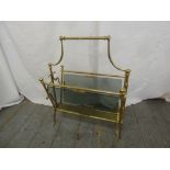 A gilded metal and glass magazine rack with central carrying handle, A/F