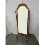 An Edwardian cheval mirror rectangular with arched top, oak frame and support