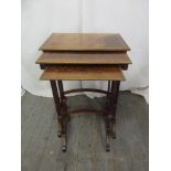 A nest of three inlaid rectangular side tables, gilded metal borders