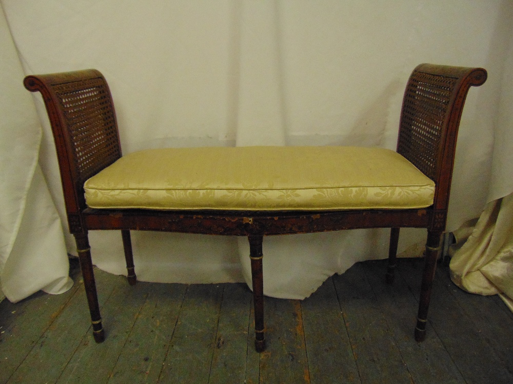 An Edwardian rectangular two seater Sheraton style love seat with scroll sides, bergere seat, on