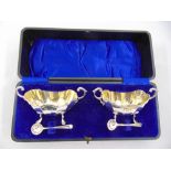 A cased pair of silver salts and condiment spoons, Birmingham 1939