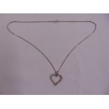 A 14ct white gold and diamond heart shaped pendant on an 18ct white gold chain, approx total