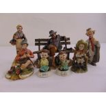 Seven Capodimonte figurines in various poses