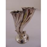 A silver two stem vase in the form of a shell on raised circular base, Birmingham 1916