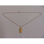 9ct yellow gold Torah scroll pendant on a 9ct gold chain, approx total weight 9.6g
